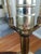 Elevate your space with this striking vintage Stiffel table lamp, a sculptural blend of solid brass and cream ceramic that...