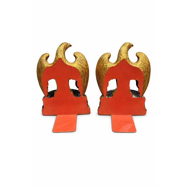 This striking pair of gilt metal eagle bookends was produced by Borghese, a respected mid-20th-century decorator brand...