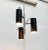 Mid Century rod pendant light with three spotlights. The design convinces with its minimalist form language. The luminaire...