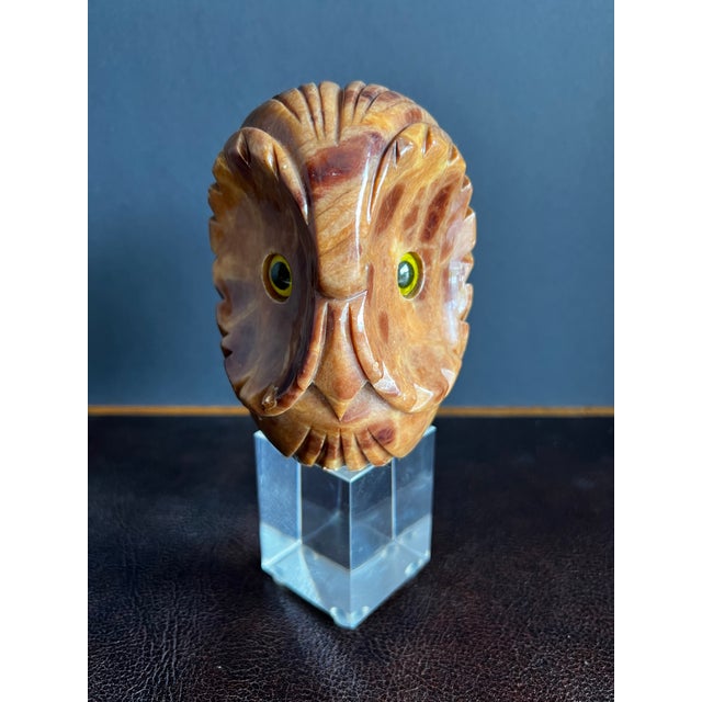 Vintage Mid 20th Century carved alabaster owl with yellow green eyes on lucite stand. Measures approximately 7.5” tall,...