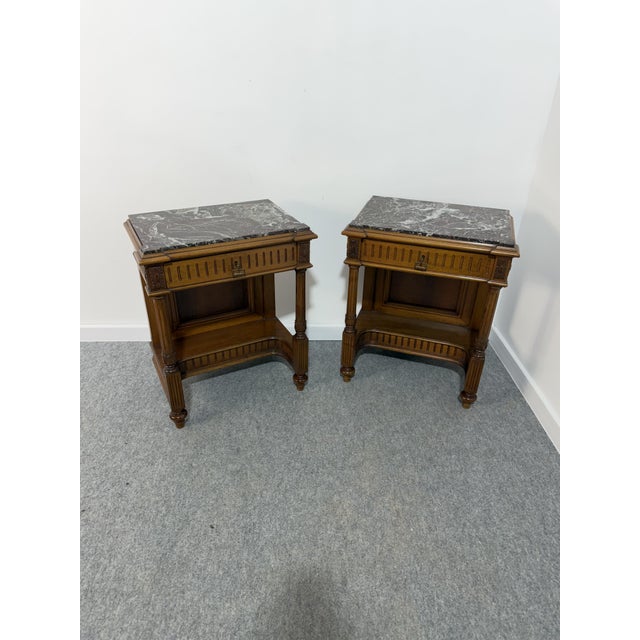 Set of 2 Italian bedside tables with marble tops, 1940 Walnut frame. Drawer on the front. Good condition, as shown in the...