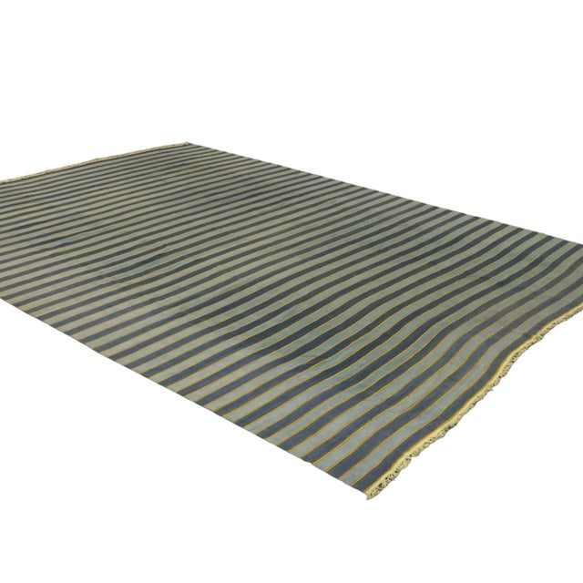 This vintage 13x17 Dhurrie flat weave is an exciting new entry in Rug & Kilim’s esteemed collection. Handwoven in wool, it...