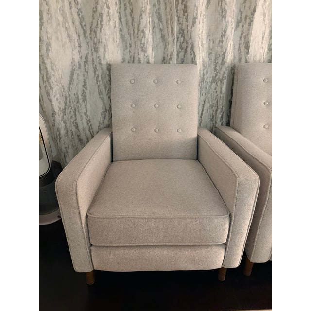 Solid wood legs. Button tufting. Hidden steel push-back mechanism.