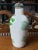 This is a Mid 20th Century Chinese Porcelain Goats Motif Snuff Bottle. It measures 3 1/8" tall and 1 1/4" in diameter. The...