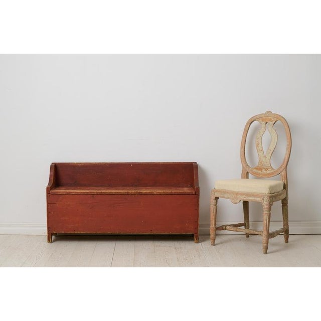 Charming antique Swedish bench in folk art from the early 1800s. Unique handmade in solid pine with the original paint...