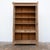 This imposing 19th-century glass-fronted bookcase is crafted primarily from oak. Its facade is punctuated by two large...