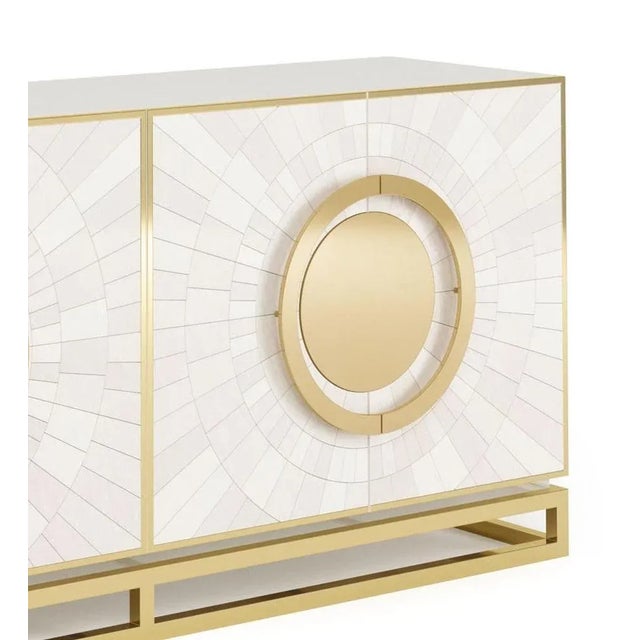 Secret sideboard by memoir essence dimensions: d 50 x w 200 x h 90 cm. Materials: brushed brass, gold leaf and white...