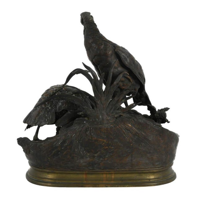 This exceptional antique bronze sculpture by Jules Moigniez presents a finely detailed bird family grouping, a subject for...