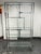 Design Plus Gallery presents the 1970's Chrome and Glass Étagère, in the style of Milo Baughman for Design Institute of...