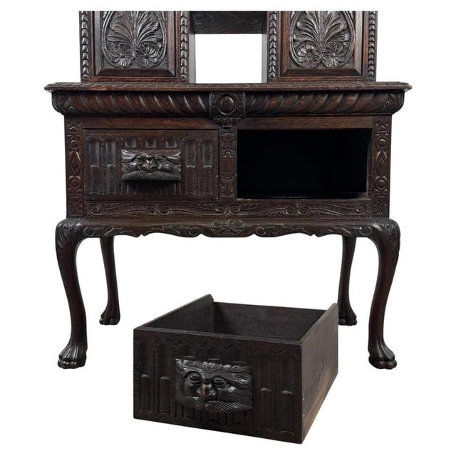 A remarkable 19th-century English cabinet, substantially constructed from solid oak and distinguished by exceptionally...