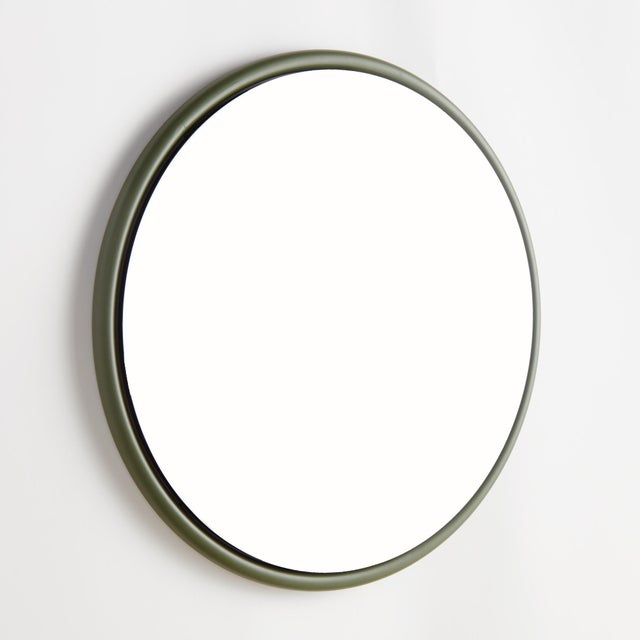 This sleek round iron stock frame in olive green is an inspired look. With a beveled edge, this stylish mirror creates a...