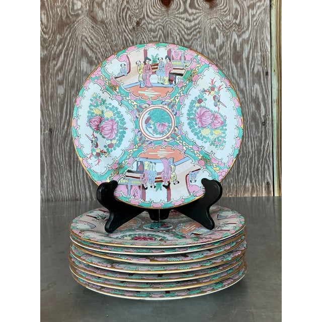 Elevate your dining experience with this exquisite set of eight Vintage Asian Rose Famille Dinner Plates, a stunning...