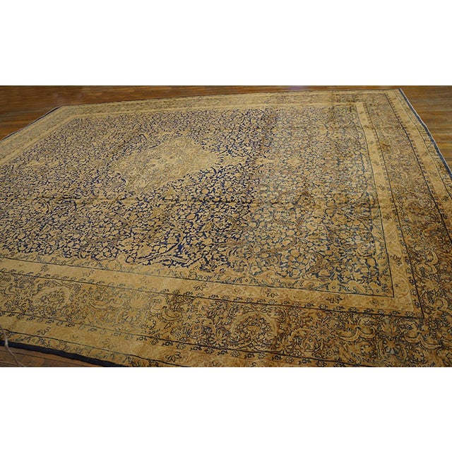 Rustic Traditional Floral-Medallion Design on Navy Background and Camel Border Color Antique Persian Kirman Rug For Sale - Image 3 of 7