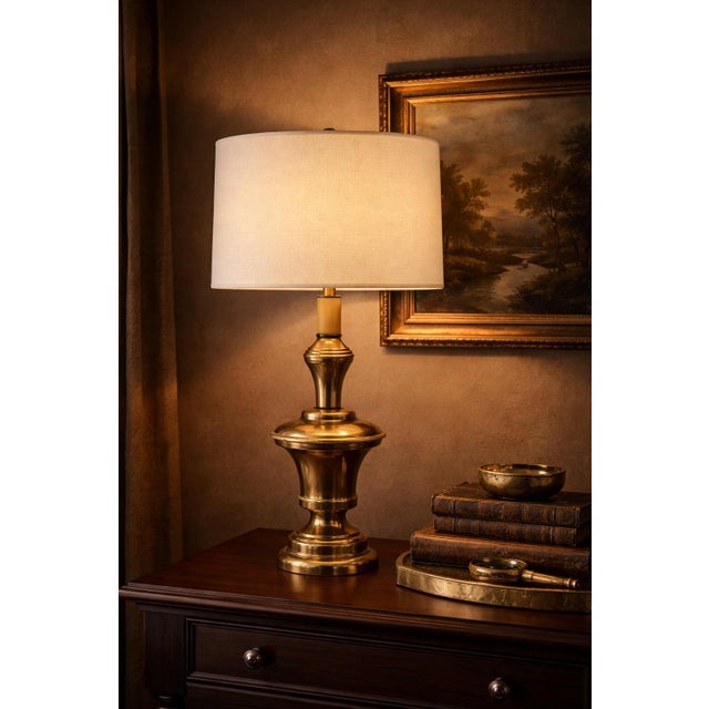 Solid vintage brass three-level touch table lamp with warm aged patina and clean 16” drum shade. Circa 1980s with original...