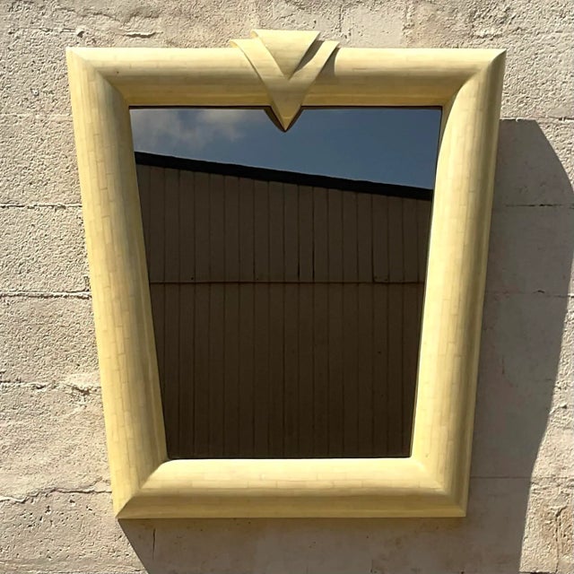 An exceptional vintage Contemporary wall mirror. Chic tessellated bone in a stunning Postmodern design. Acquired from a...