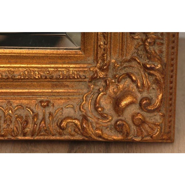 Delve into the timeless elegance of this Antique Gilt Mirror from the 1920s, a coveted piece for discerning designers and...