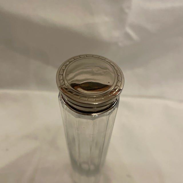 Antique tall and slender French faceted crystal toilette canister with engraved silver plated lid. Would have possibly...