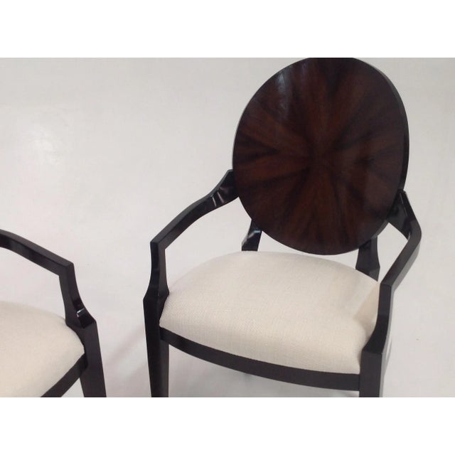 Pair of Walnut arm chairs. Deco style modern chairs are in excellent condition and ready to enjoy. Fabric is a cream...