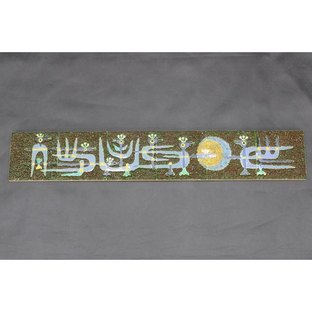 This Mid-Century Modern ceramic wall panel was created in Czechoslovakia during the 1970s and features a stylized bird...