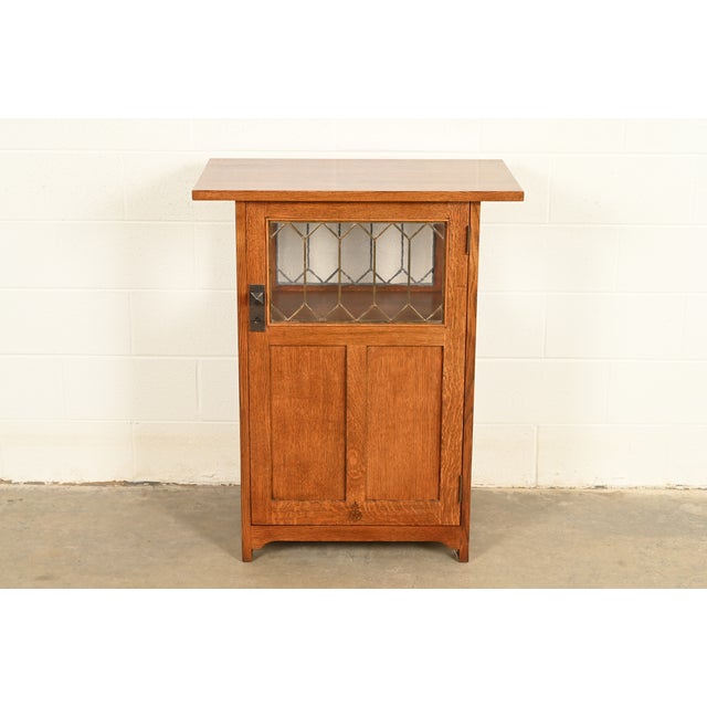A gorgeous Mission or Arts & Crafts solid oak chafing dish stand or side cabinet Designed by Roycroft and produced by...