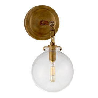 Thomas O'Brien for Visual Comfort Signature Katie Small Globe Sconce in Hand-Rubbed Antique Brass with Clear Glass For Sale
