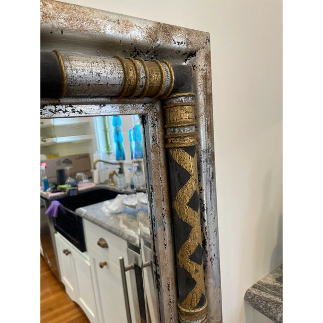 Stunning John-Richard Decorative Wall Mirror with a modern twist on neoclassical design. Silver fleck finish adorned with...