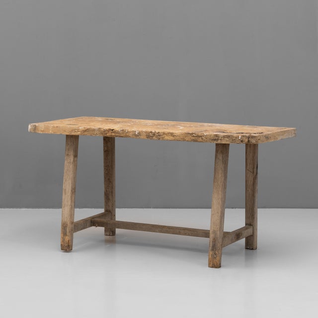 Rustic stretcher table with worktop surface. Circa 1900.