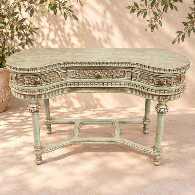 A very pretty dressing table, which can also be used as a console table, made of carved and painted pine, dating from the...