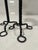 American, early 20th century. A two piece grouping of Arts & Crafts Period candlesticks. Each constructed with a twisted...