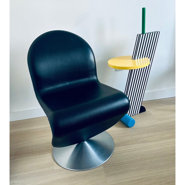 Verner Panton System 1-2-3 Swivel Chair Design Verner Panton, 1973 Brushed aluminum base Black leather upholstery Made by...