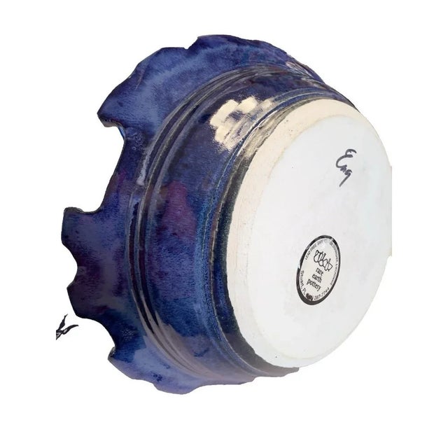 This Rare Earth Pottery Fish Bowl is a stunning 12" round dish handcrafted in America in the 1990s. The blue tropical...
