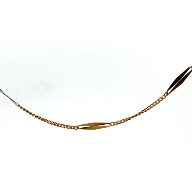 This beautiful French bar chain is made in 18k yellow gold and is 61 inches in length. The chain features alternating...