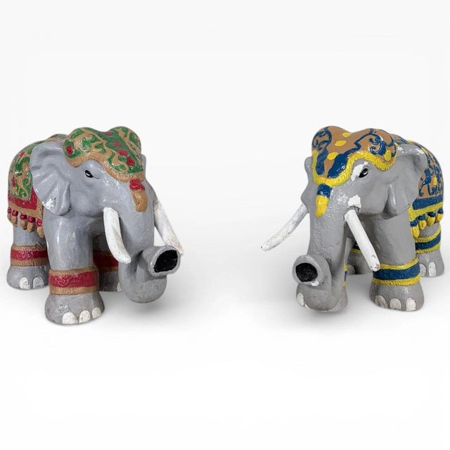 These vintage elephant sculptures bring timeless charm and global flair to your home décor. The hand painted elephants...