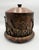 Vintage Maitland-Smith safari-themed lidded canister. It features a textured leather-like finish on the cylindrical body...