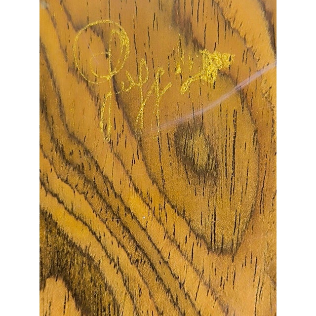 Elegant chest of drawers by Gaggioli in elm burl and brass, produced in 1970: a high-quality vintage piece that combines...