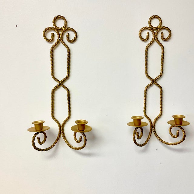 These are a gorgeous pair of 1970s Hollywood Regency French style wall candle holder scones. Each sconce has 2 arms that...
