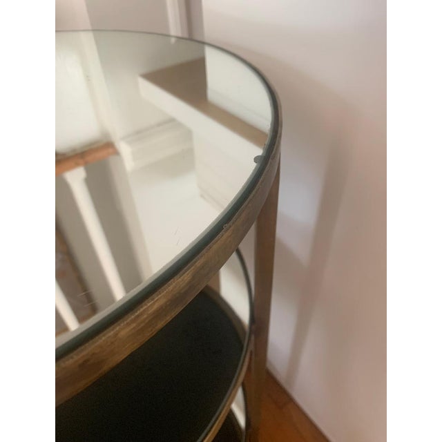 Arteriors Percy Table - Antique Brass Finish 18.5" D 24" H Three mirrored shelves / Mirror is not antiqued. Used Condition...