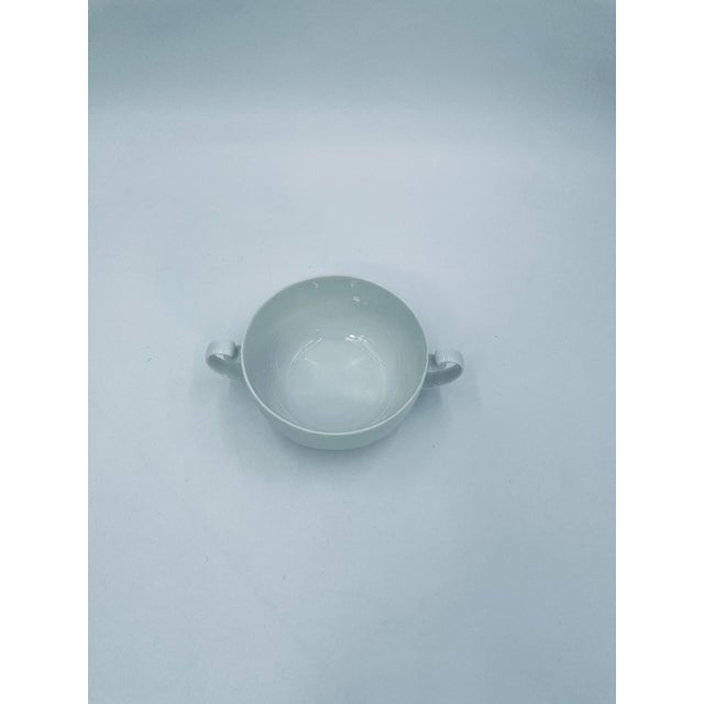 This soup jug from the renowned German manufacturer Rosenthal Studio Line, from the Asymmetria White series, is made of...