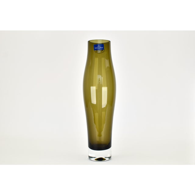 Beautiful glass vase by Villeroy & Boch. The vase has a stunning olive green color and reminds of the mid century modern...
