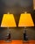 A sculptural pair of vintage chrome table lamps in a stepped, “skyscraper” form, likely dating to the late 20th century....
