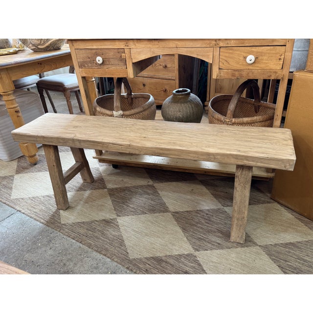 Made of asian hardwood, this bench features a deeply textured, weathered finish that emphasizes the wood's rugged grain...