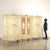Carved and lacquered Venetian Baroque style wardrobe, second half of the 20th century. Rounded in shape, it is made with...