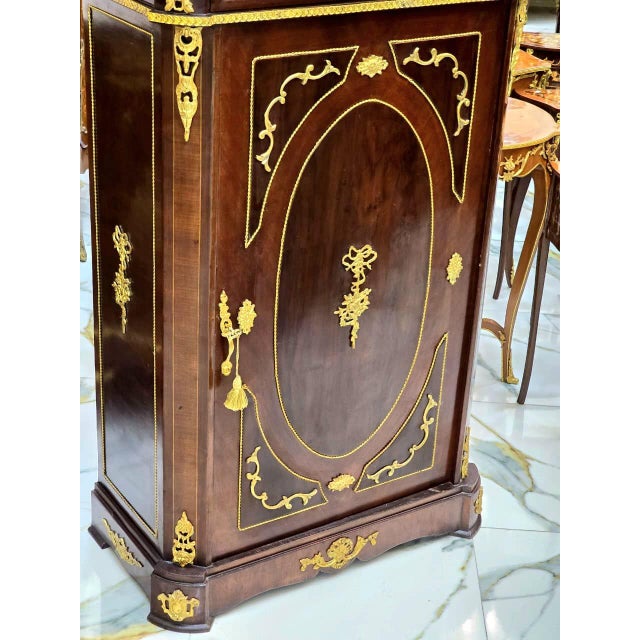 Enhance your interior with this magnificent Louis XVI-inspired commode cabinet, a sophisticated statement piece that...