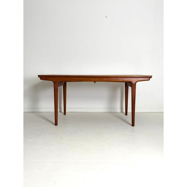 Johannes Andersen Teak Extending Dining Table, Uldum Møbelfabrik, 1960s An elegant Danish extending dining table designed...