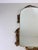 Italian ornate brass framed wall mirror, Italy, 1960s. This decorative vintage mirror features a softly arched mirror...