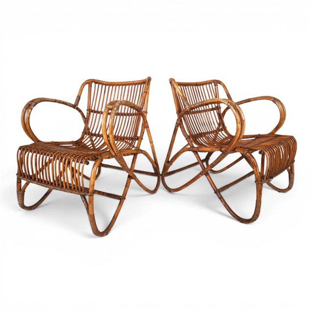 This pair of vintage lounge chairs combines the natural elegance of rattan and bamboo with the playful design language of...