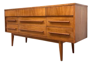 Vintage Mid-Century Modern Low Dresser With Sculpted Pulls and Tapered Legs.