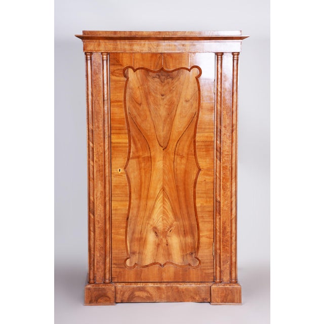 This elegant cabinet, which dates back to the 1840s, was manufactured in Austria and represents an exceptional and...