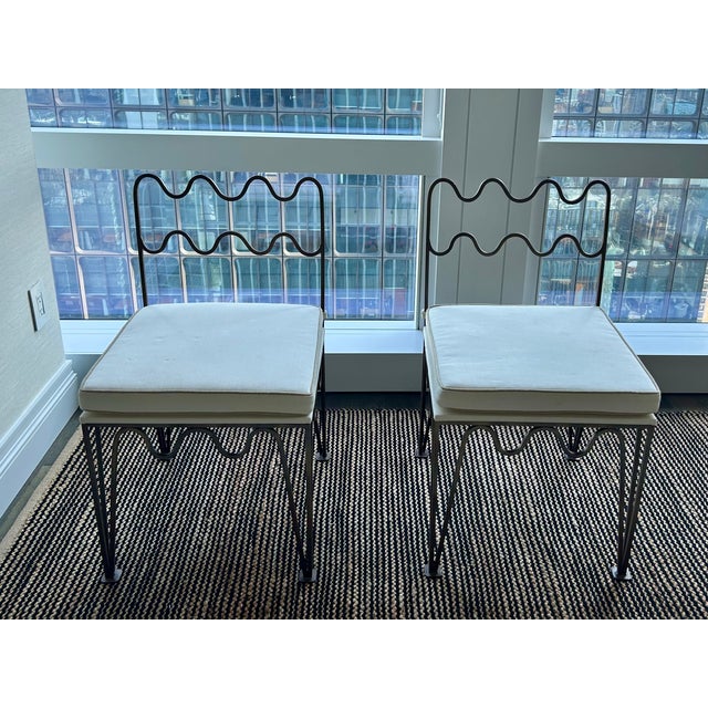Pair of 'Méandre' side chairs by Design Frères. Steel frame with bronze patina, natural linen upholstered cushions. Made...