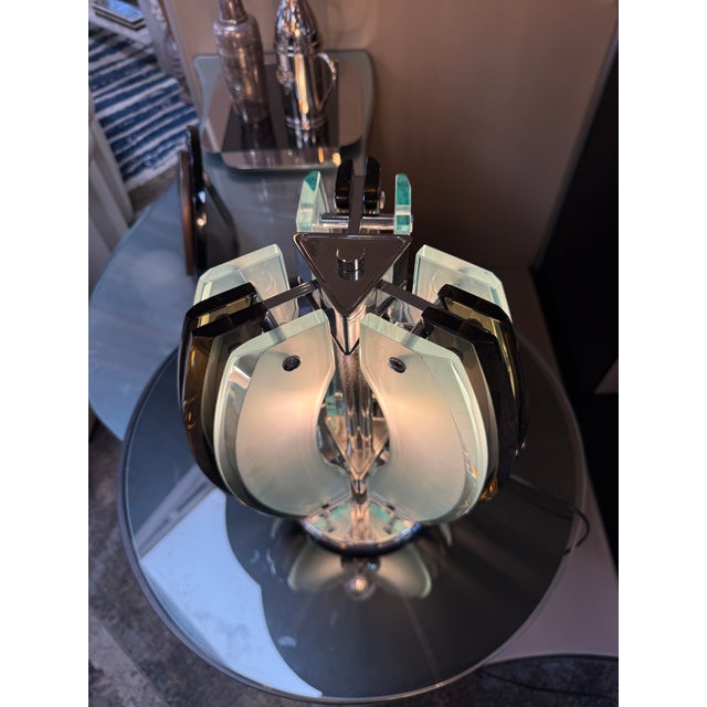 Striking Italian space age table lamp by Veca for Fontana Arte, dating from the 1970s. The lamp features four sculptural...